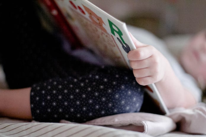 public-domain-images-free-stock-photos-little-girl-child-reading-book-bedtime-nap-1